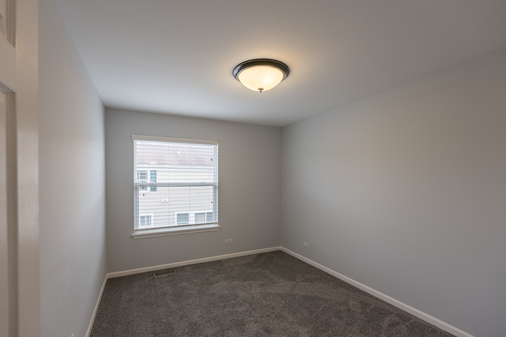 2430 Courtyard Circle, Unit 6 Aurora, IL 60506 - Photo 18 of 28 an empty room with a window