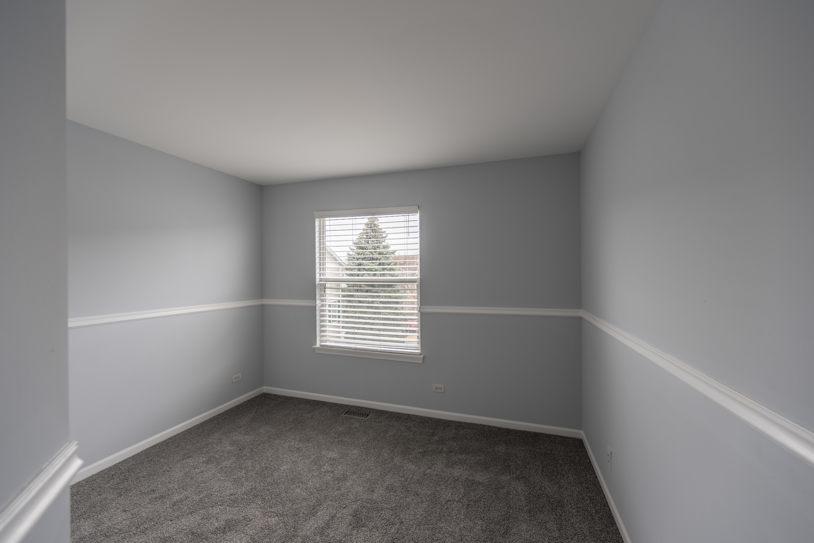 2430 Courtyard Circle, Unit 6 Aurora, IL 60506 - Photo 19 of 28 an empty room with a window
