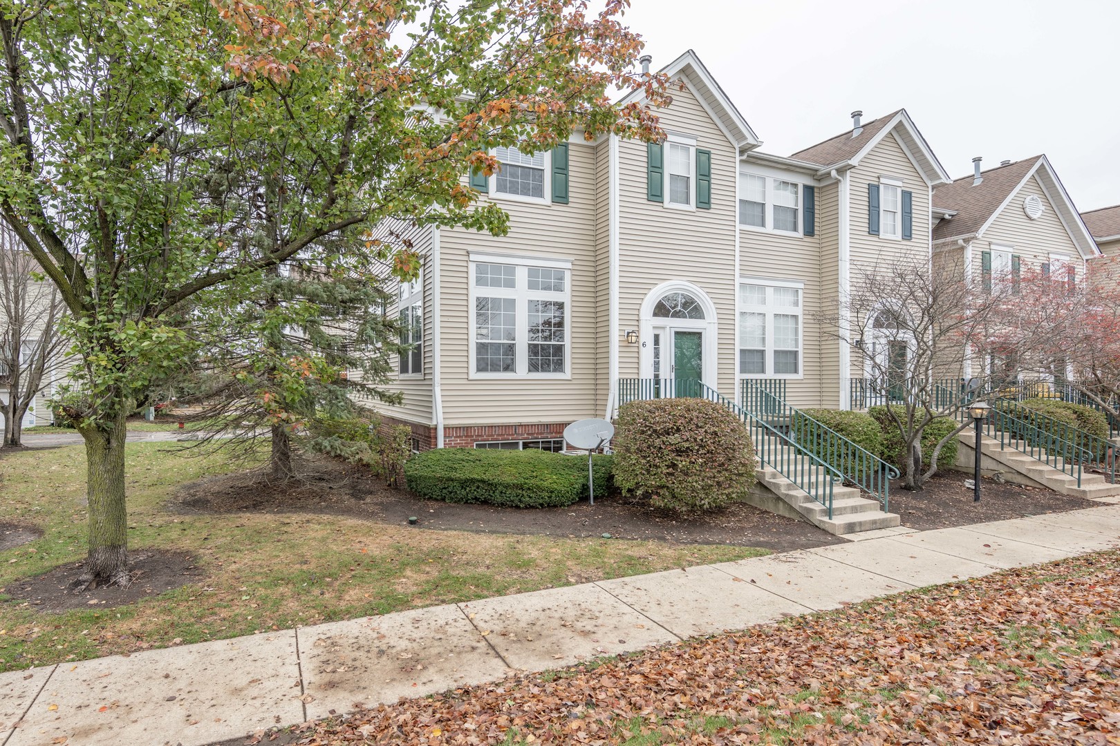 2430 Courtyard Circle, Unit 6 Aurora, IL 60506 - Photo 2 of 28 a front view of a house with garden