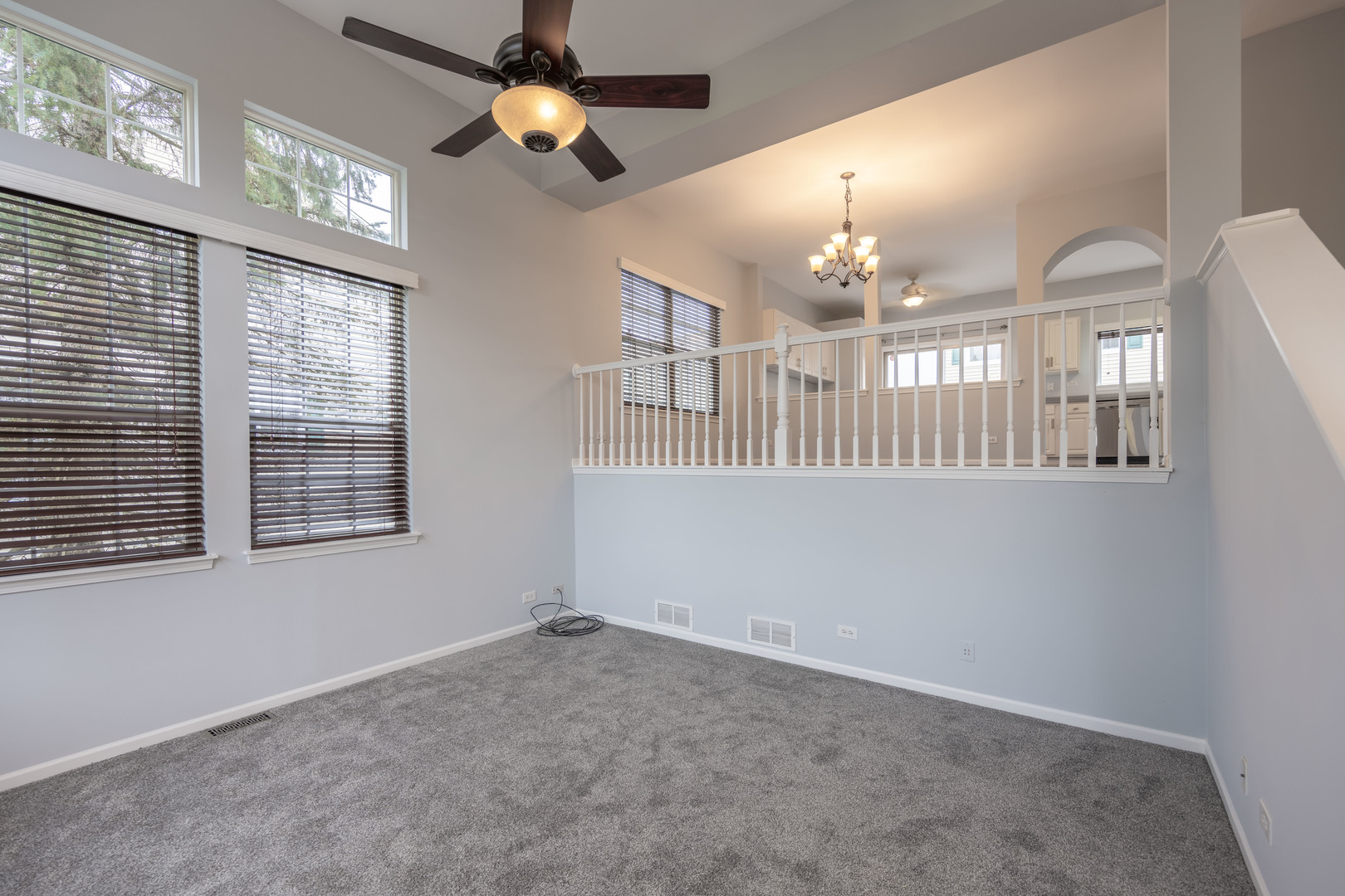 2430 Courtyard Circle, Unit 6 Aurora, IL 60506 - Photo 6 of 28 wooden floor in an empty room with a window