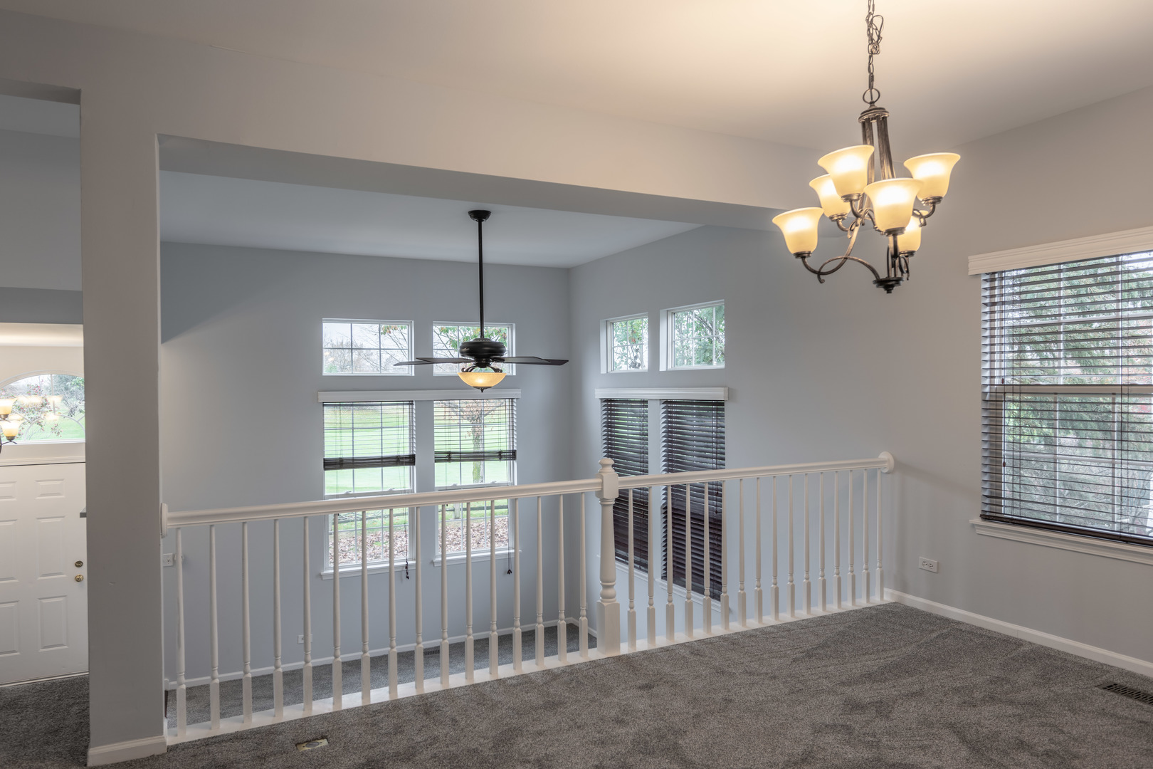 2430 Courtyard Circle, Unit 6 Aurora, IL 60506 - Photo 8 of 28 a view of a room with a large window chandelier