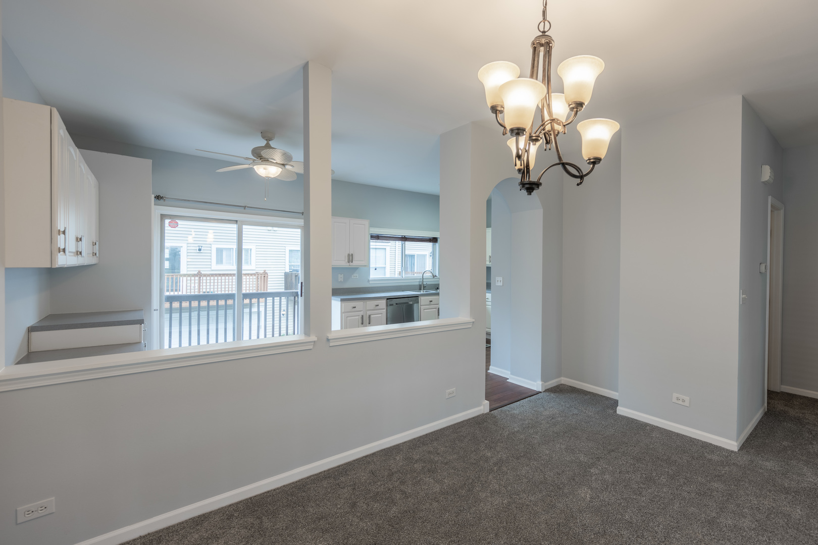 2430 Courtyard Circle, Unit 6 Aurora, IL 60506 - Photo 9 of 28 a view of a livingroom with a chandelier