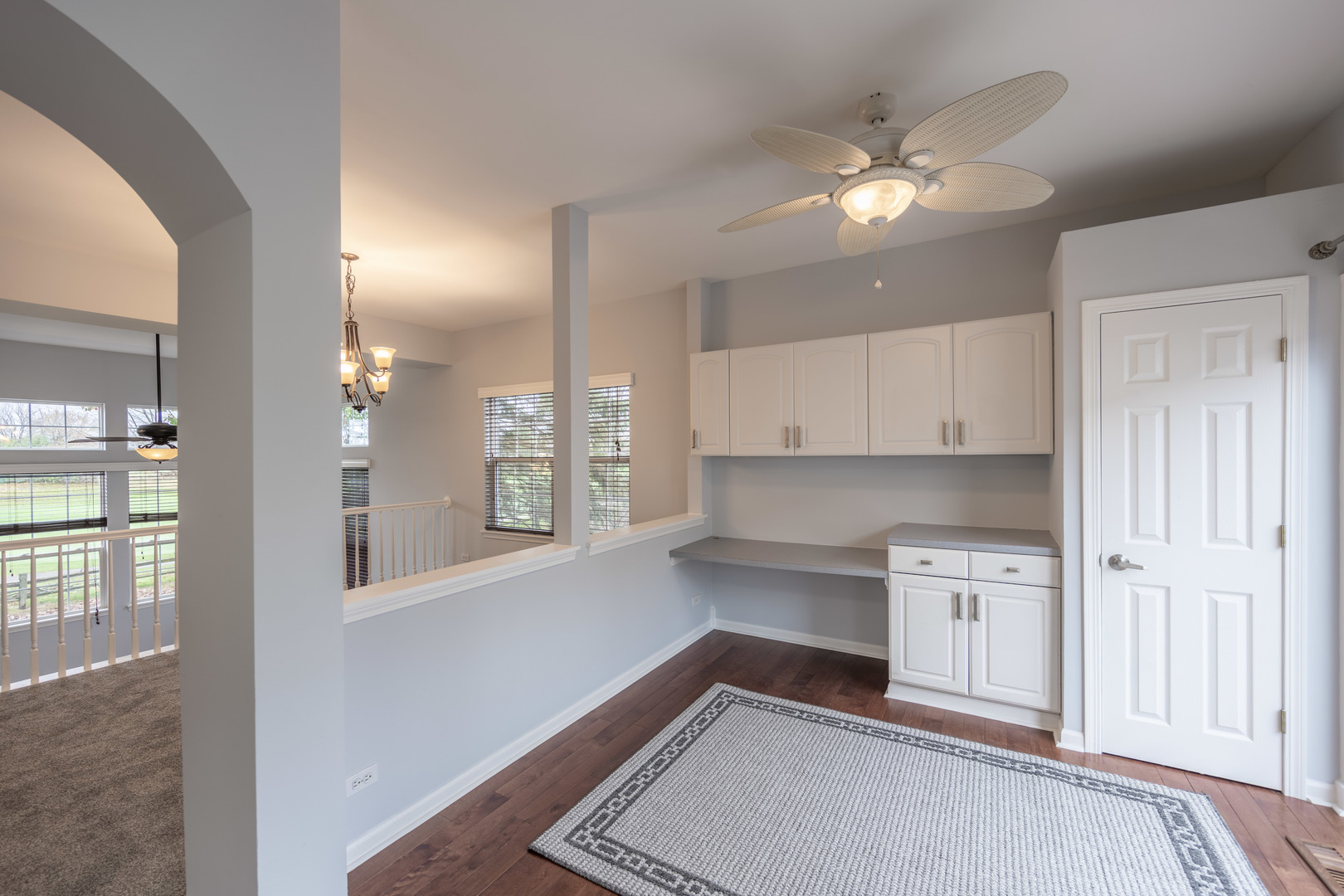 2430 Courtyard Circle, Unit 6 Aurora, IL 60506 - Photo 10 of 28 a view of a kitchen with wooden floor and a kitchen