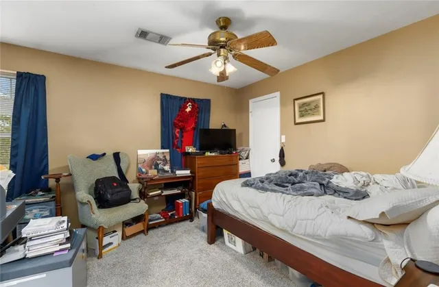 a bedroom with a bed and furniture