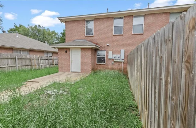 a front view of a house with yard