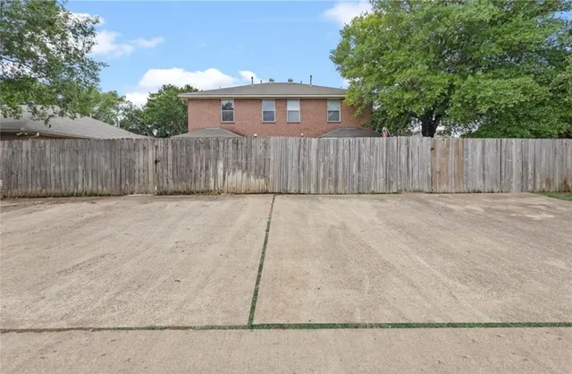 a view of backyard and tree