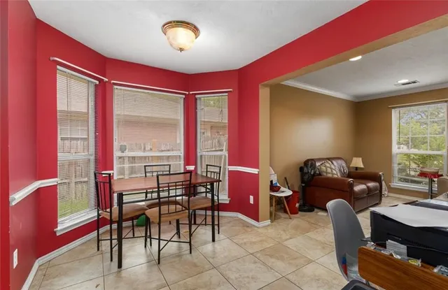 a livingroom with furniture and a large window