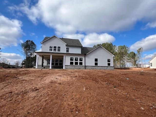 5430 Settingdown Road Cumming, GA 30041 - Photo 15 of 15 a front view of house with yard and trees in the background