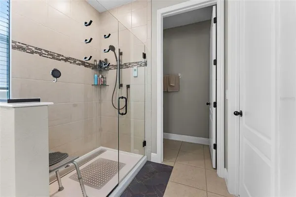 a white toilet sitting next to a bathroom sink