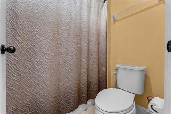 a room with furniture and a floor to ceiling window