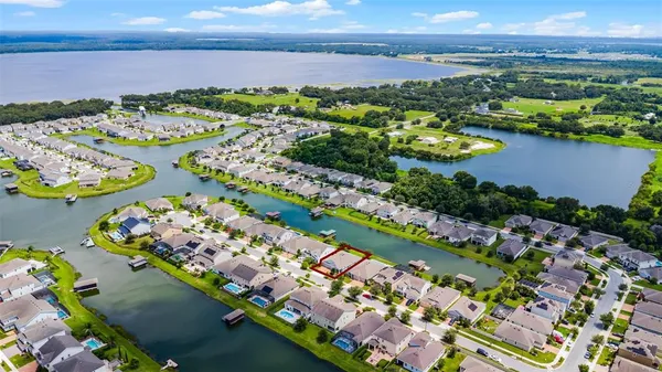 an aerial view of city and lake