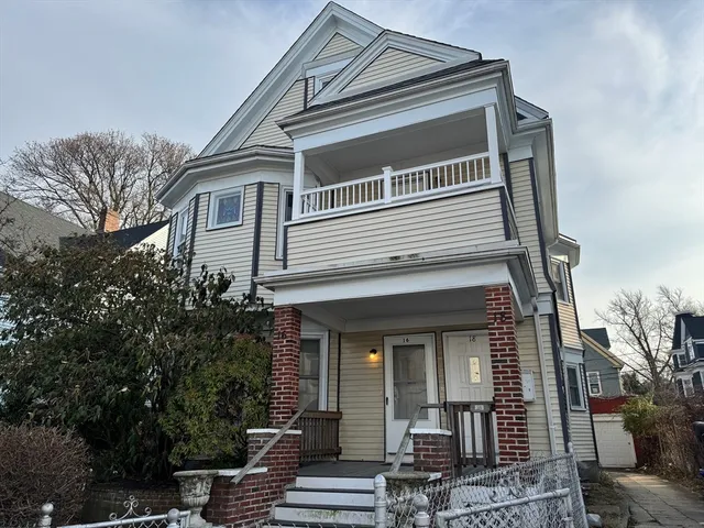 a front view of a house with stairs
