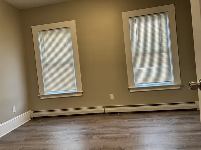 a view of a livingroom with an empty space and window
