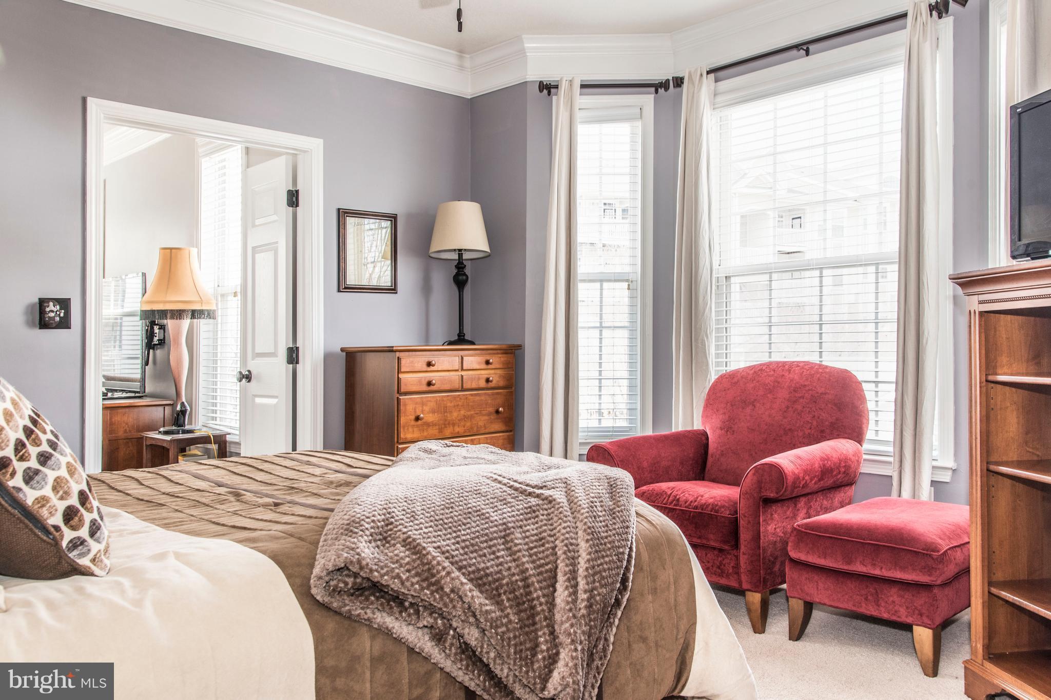 504 Sunset View Terrace Southeast, Unit 206 Leesburg, VA 20175 - Photo 16 of 18 a bedroom with bed and a window