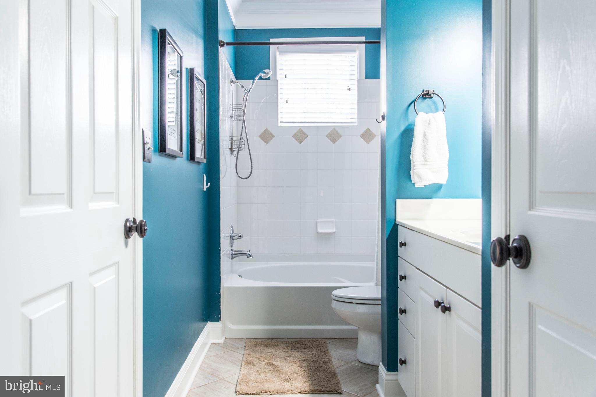504 Sunset View Terrace Southeast, Unit 206 Leesburg, VA 20175 - Photo 17 of 18 a bathroom with a tub and shower