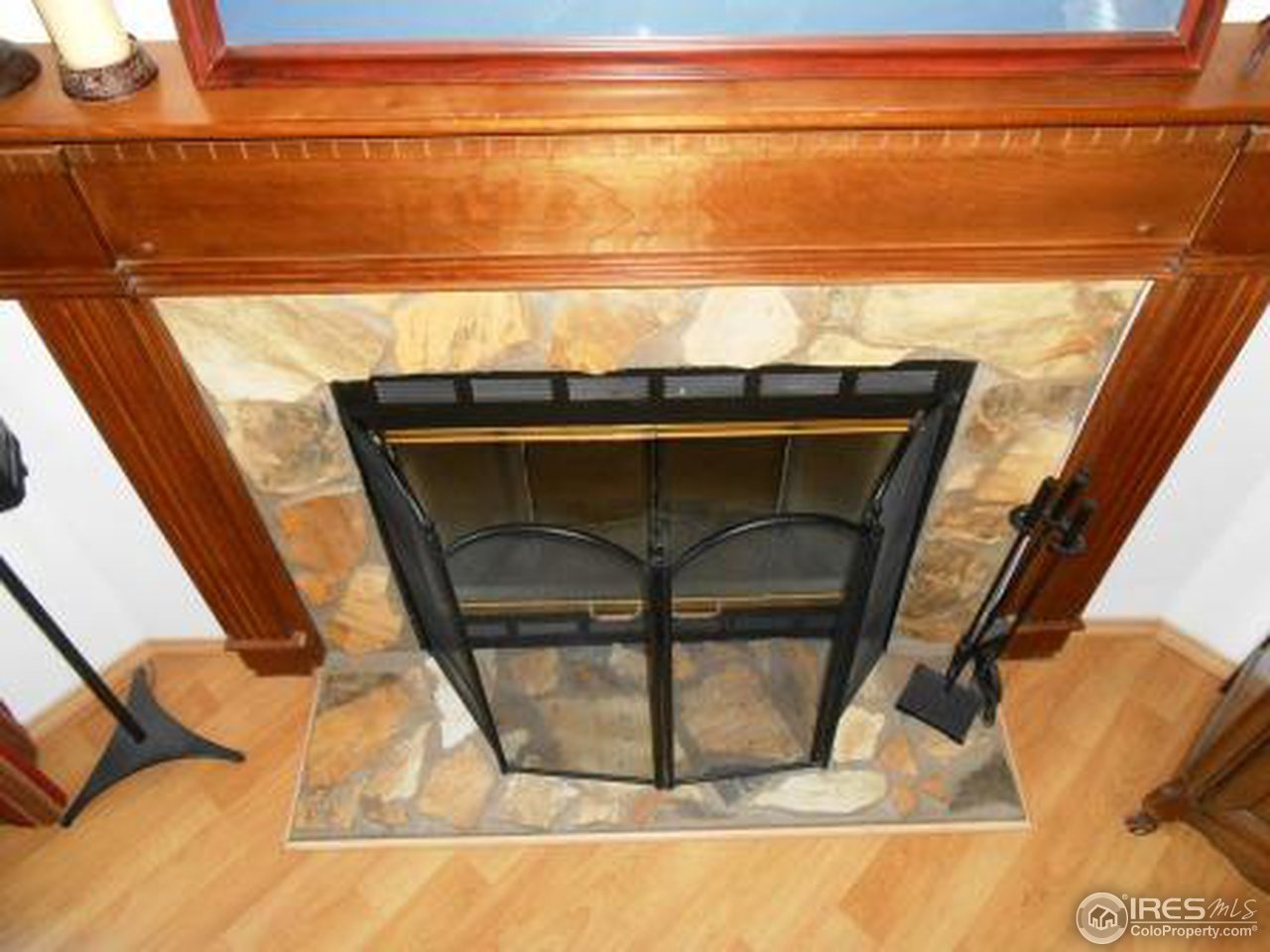 18516 Centennial Road Fort Morgan, CO 80701 - Photo 21 of 25 Living Room Wood Fireplace