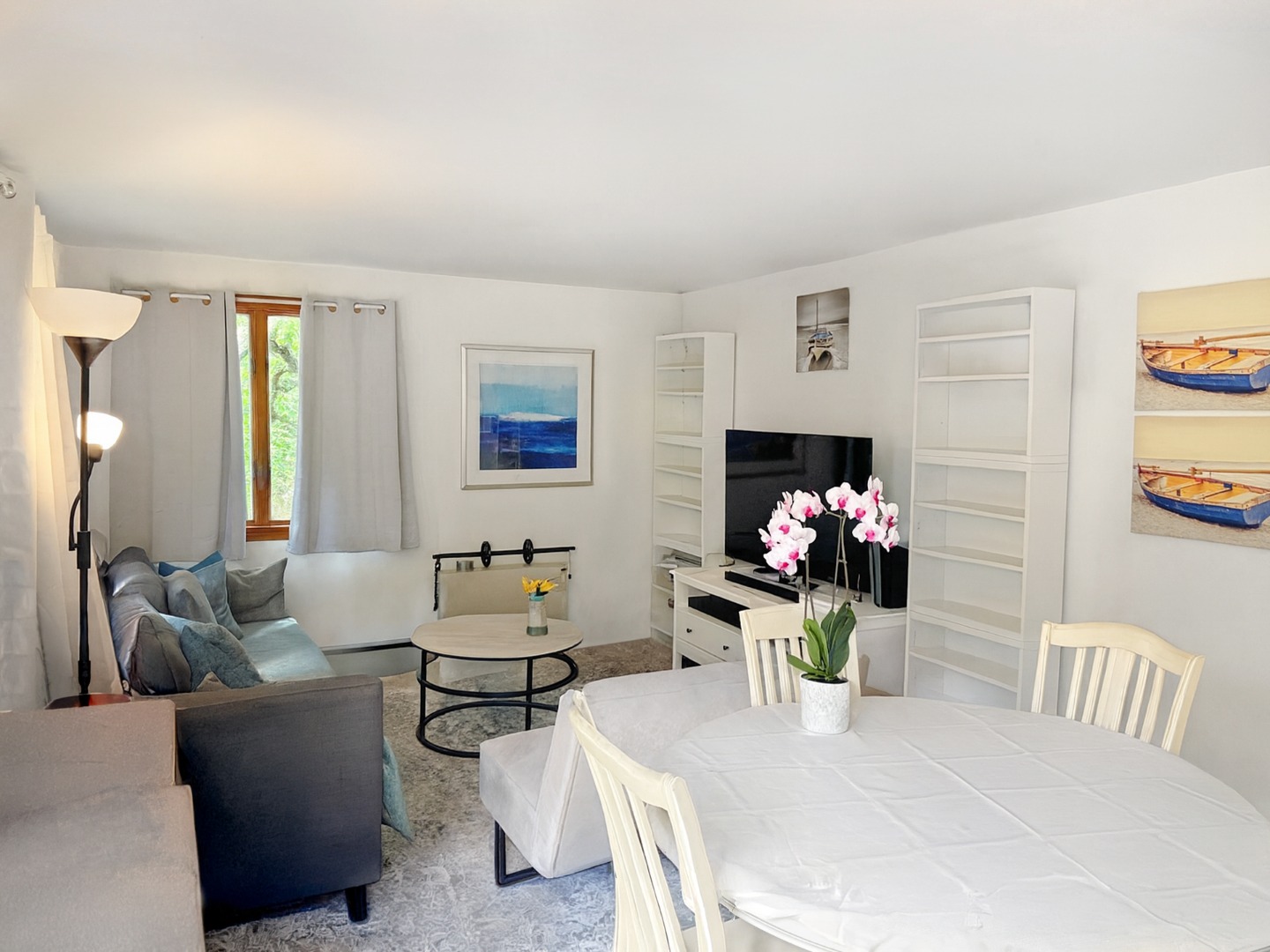 47 Quenames Road Chilmark, MA 02535 - Photo 8 of 8 a living room with furniture potted plant and a fireplace