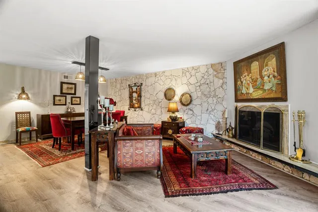a living room with furniture window and flat screen tv
