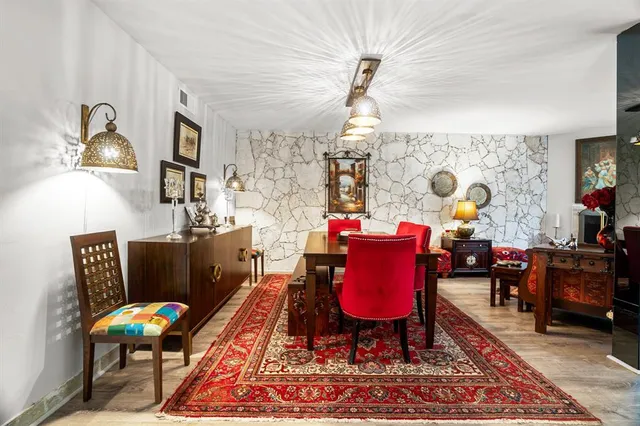 a living room with furniture rug and window
