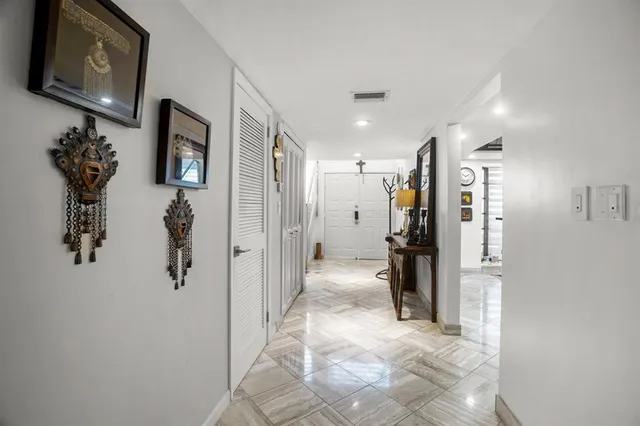 a view of a hallway with closet