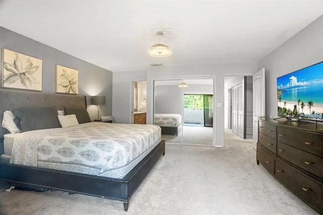 a spacious bedroom with a bed and window