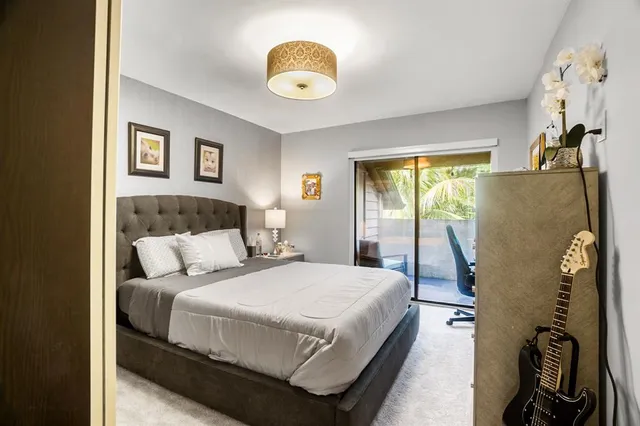 a bedroom with bed and a window