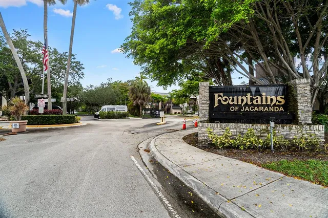 a sign board with a yard