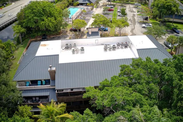 an aerial view of a house with a garden