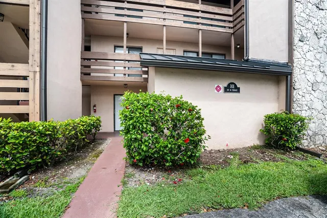 a view of a window of a house with a yard