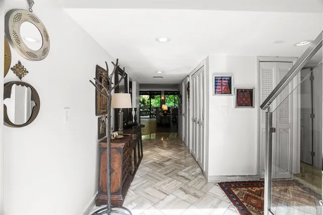 a view of a hallway view with staircase