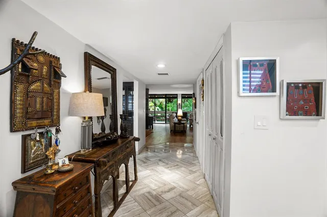 a view of a hallway with living room