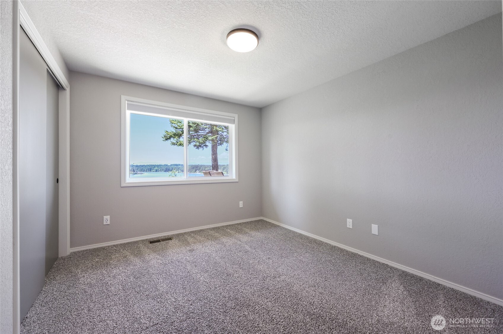 7713 78th Loop Northwest Olympia, WA 98502 - Photo 27 of 40 an empty room with a window