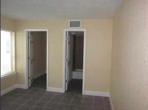 a view of an empty room and window
