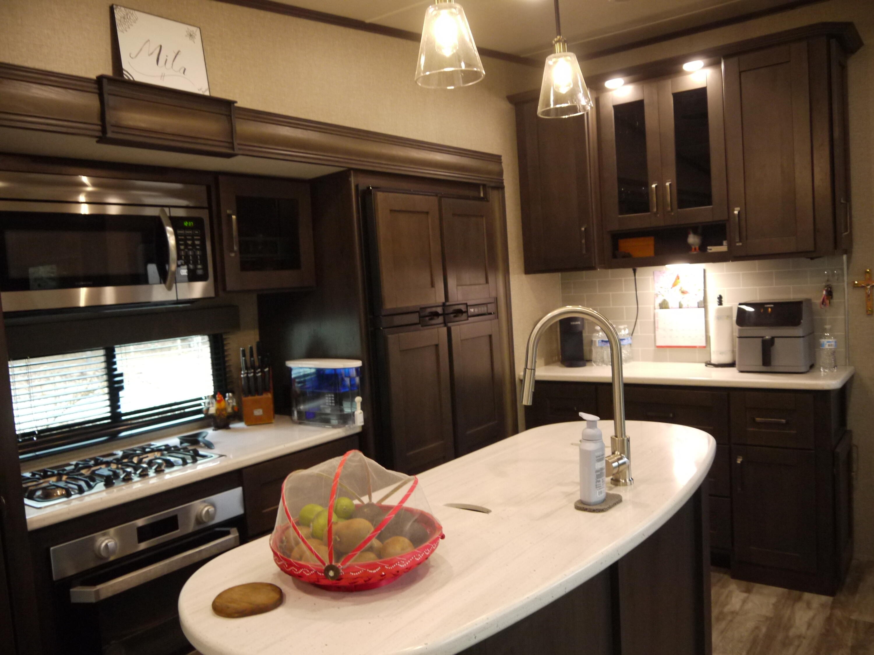 4449 Yellow Bluff Road Crestview, FL 32539 - Photo 26 of 42 a kitchen with a sink and refrigerator