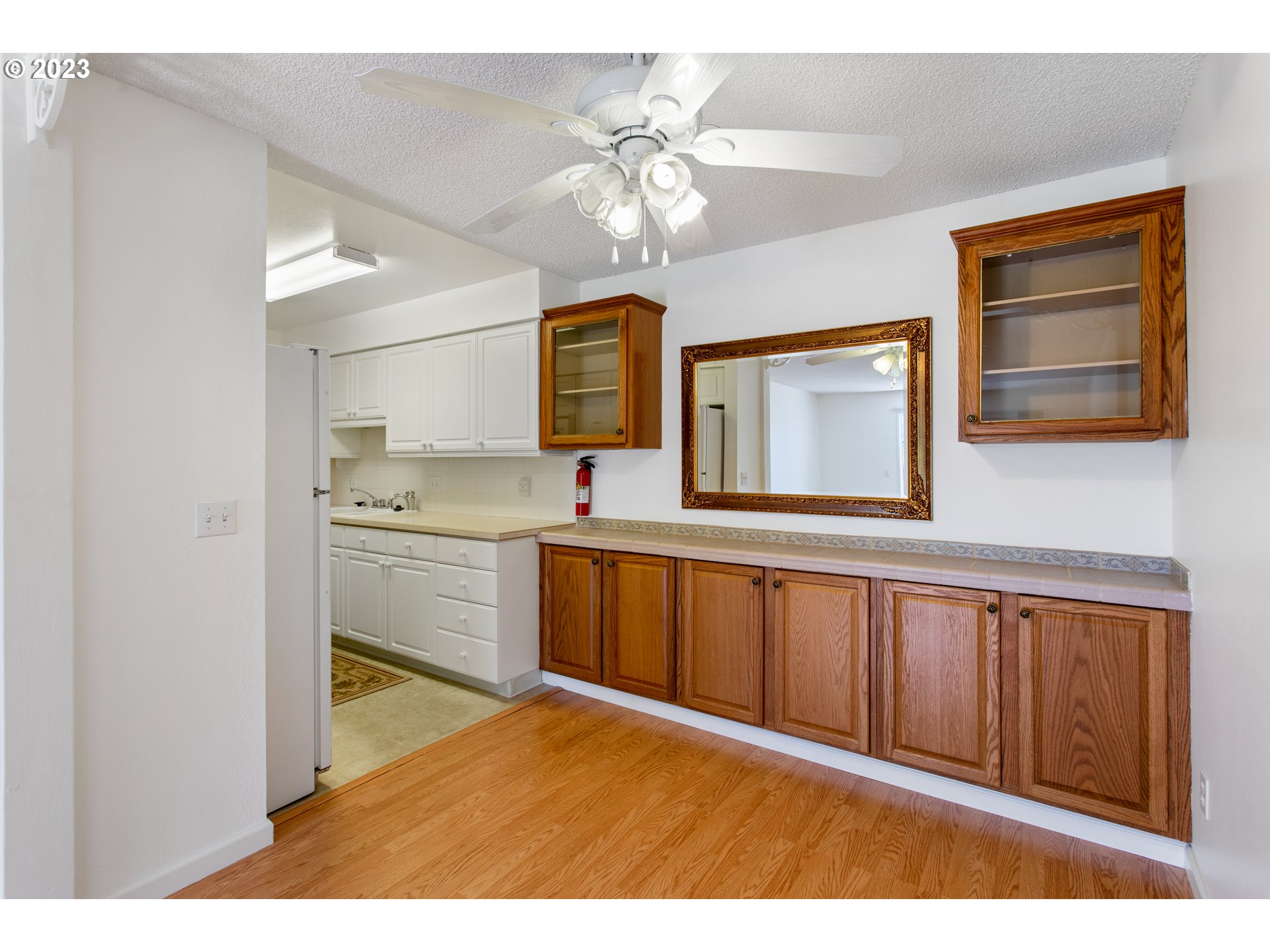 950 Evergreen Road, Unit 115 Woodburn, OR 97071 - Photo 5 of 22 a kitchen with stainless steel appliances granite countertop a sink cabinets and wooden floor