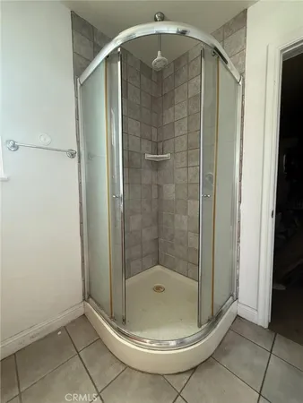 a bathroom with a shower and vanity