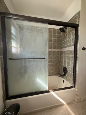 a kitchen with granite countertop a sink and cabinets