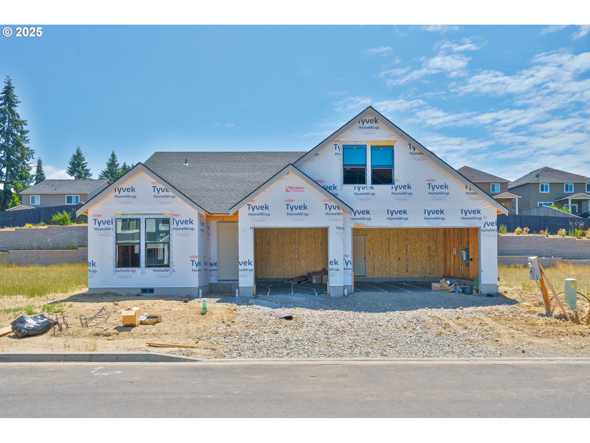 3623 North 11th Circle Ridgefield, WA 98642 - Photo 1 of 3 a view of a house next to a yard with large trees