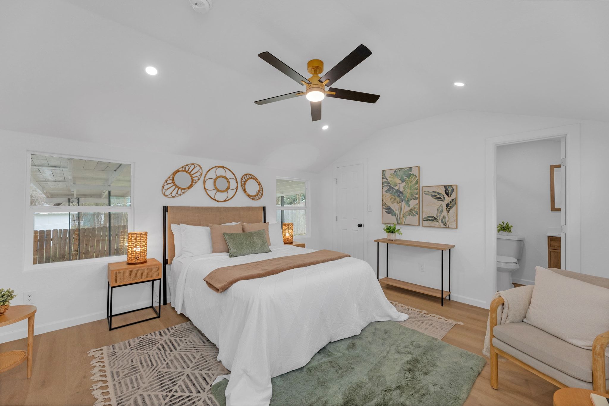 1709 Cecelia Street Taylor, TX 76574 - Photo 18 of 37 Bedroom featuring light wood-style floors, recessed lighting, a ceiling fan, lofted ceiling, and ensuite bath