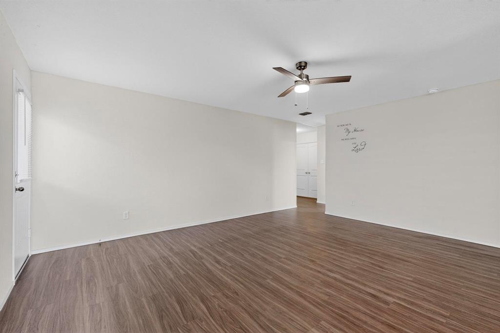 5516 McClelland Street Forney, TX 75126 - Photo 15 of 36 Unfurnished room with dark wood finished floors and ceiling fan