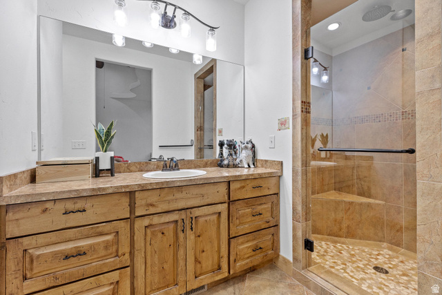 98 Bridge Road Rockville, UT 84763 - Photo 25 of 75 Bedroom #3 – En-Suite Full Bathroom. Bathroom with a stall shower, vanity, light tile patterned flooring, and recessed lighting
