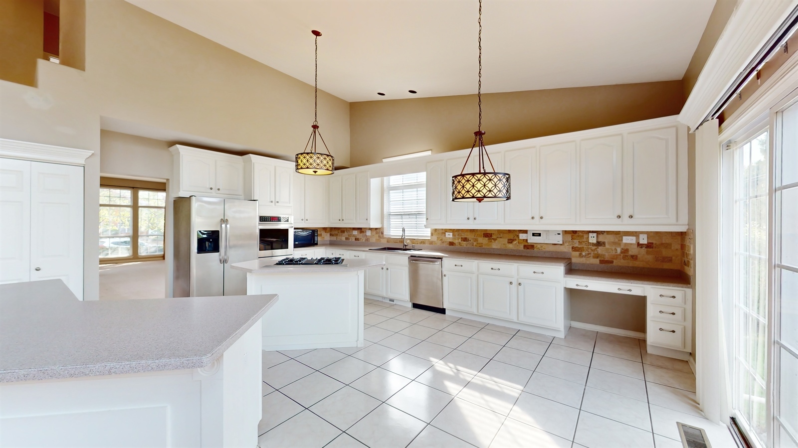 627 Conestoga Road Naperville, IL 60563 - Photo 11 of 46 a kitchen with a sink window and stainless steel appliances