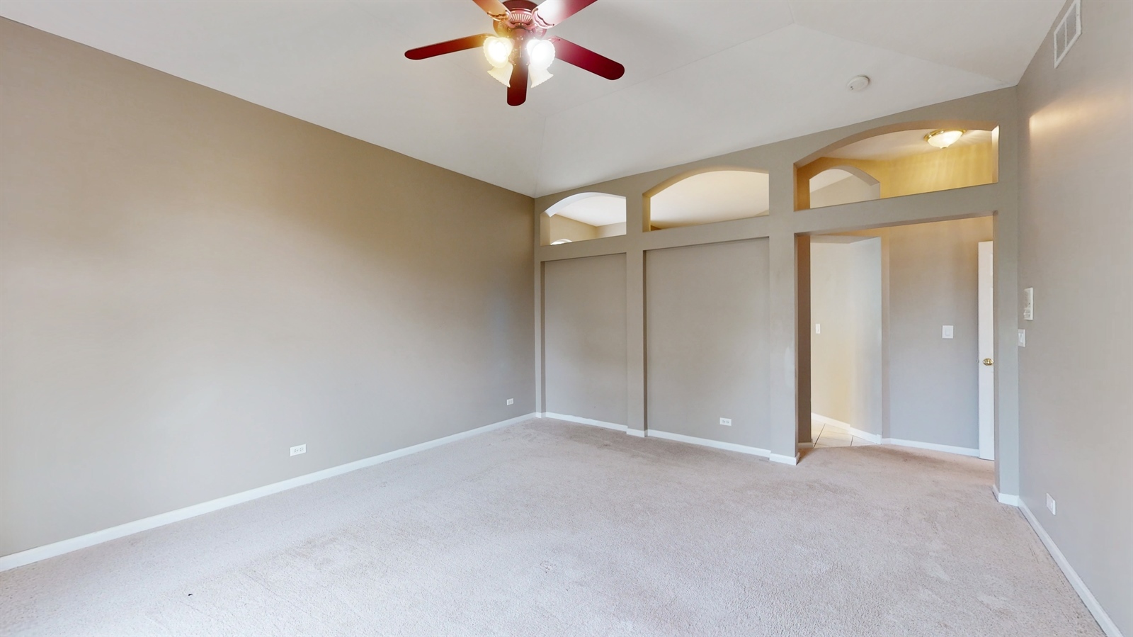 627 Conestoga Road Naperville, IL 60563 - Photo 15 of 46 a view of an empty room with a chandelier fan