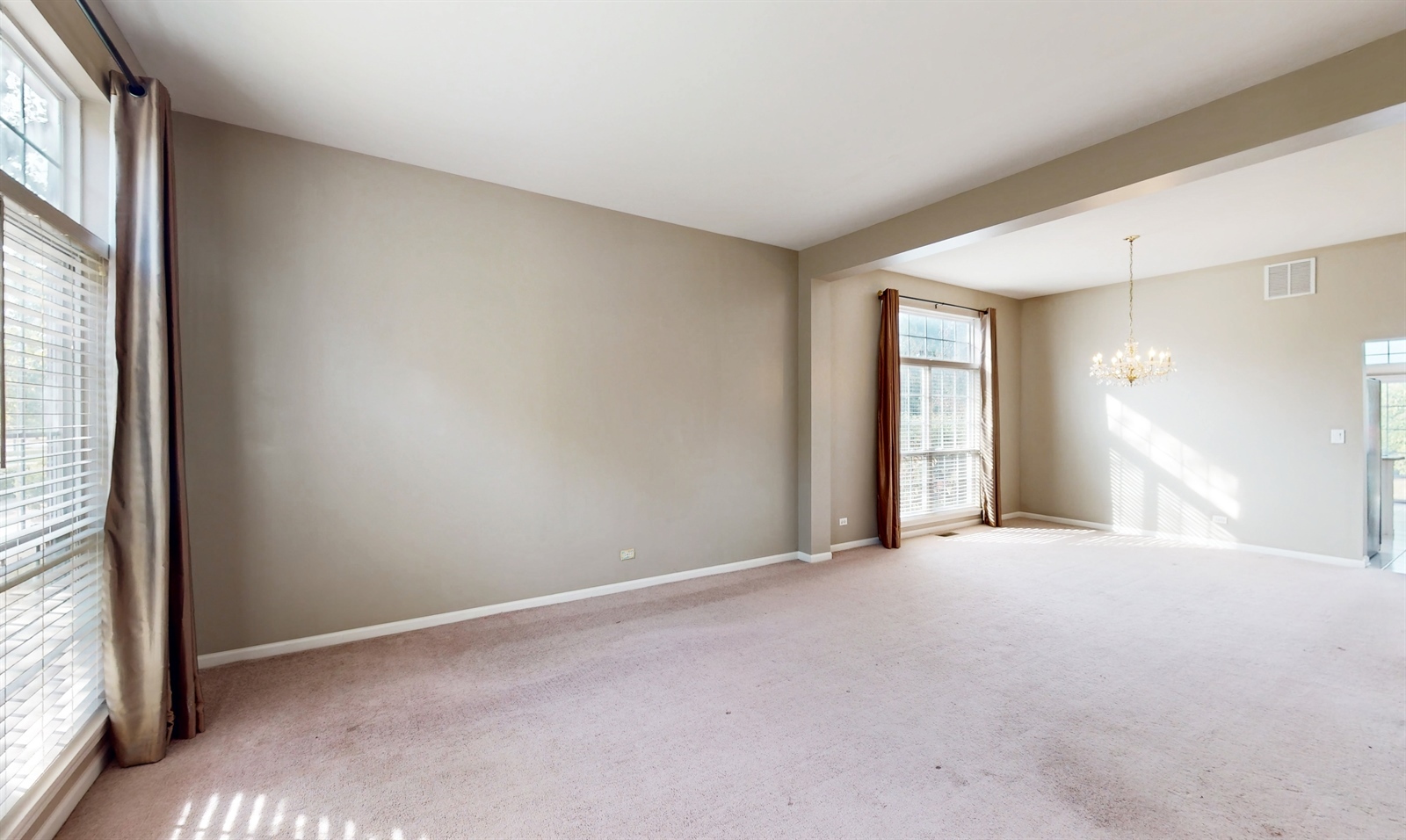627 Conestoga Road Naperville, IL 60563 - Photo 6 of 46 a view of an empty room with a window