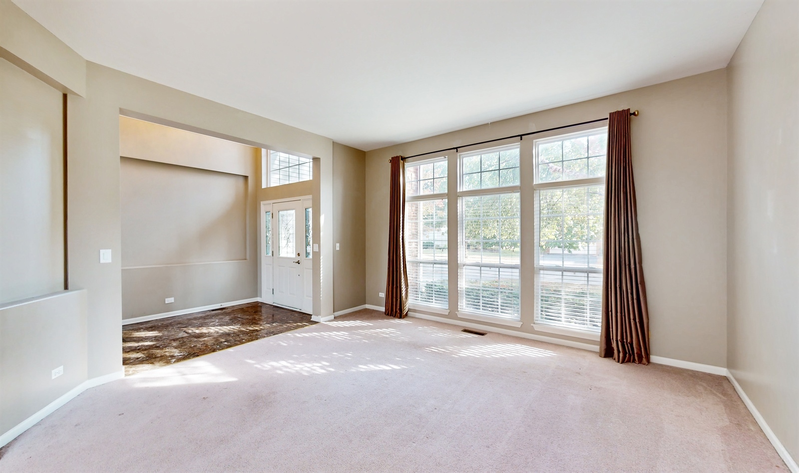 627 Conestoga Road Naperville, IL 60563 - Photo 7 of 46 a view of an empty room with a window