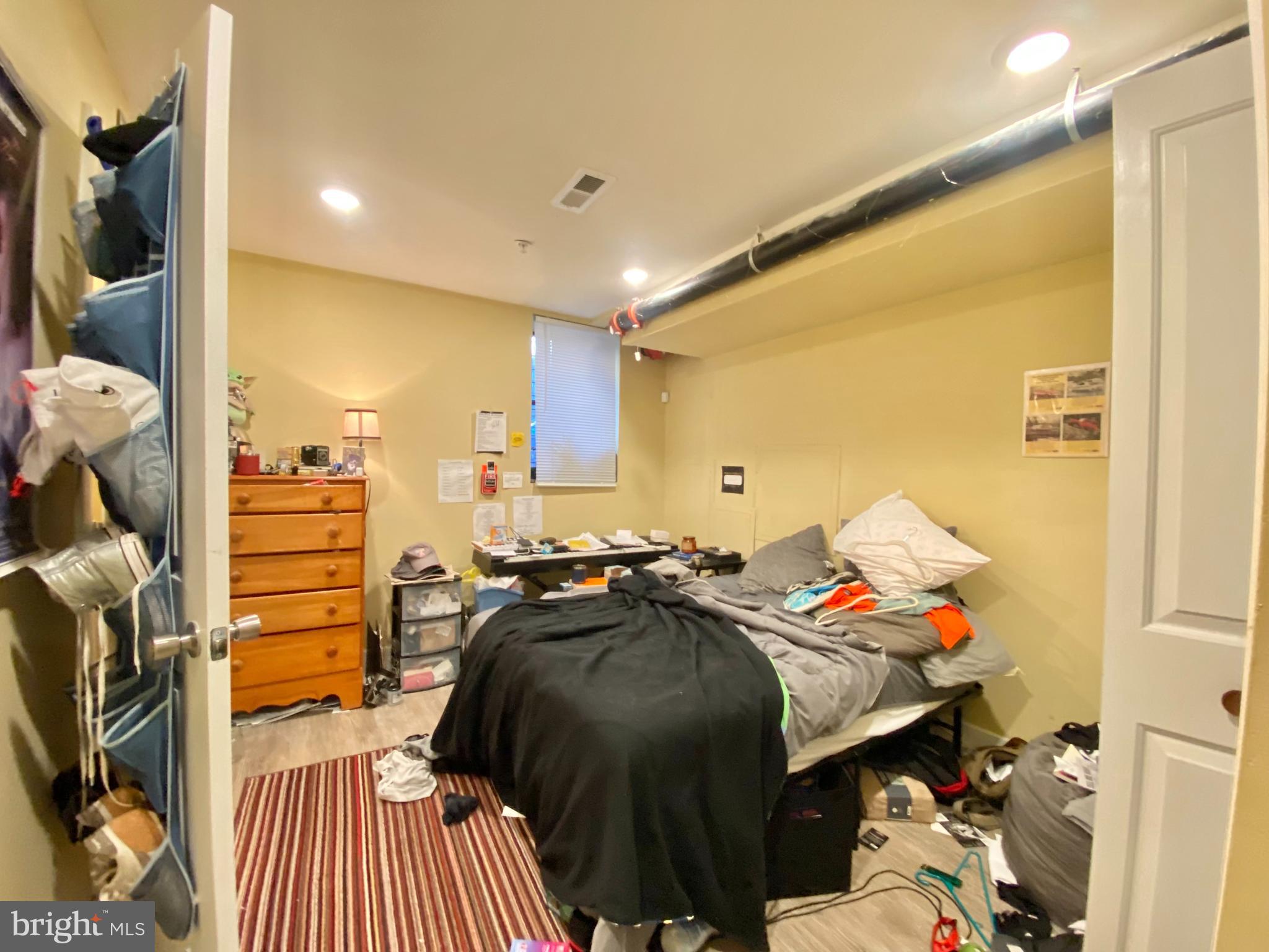 2214 North Camac Street, Unit A Philadelphia, PA 19133 - Photo 12 of 18 a bed room with a bed and a closet