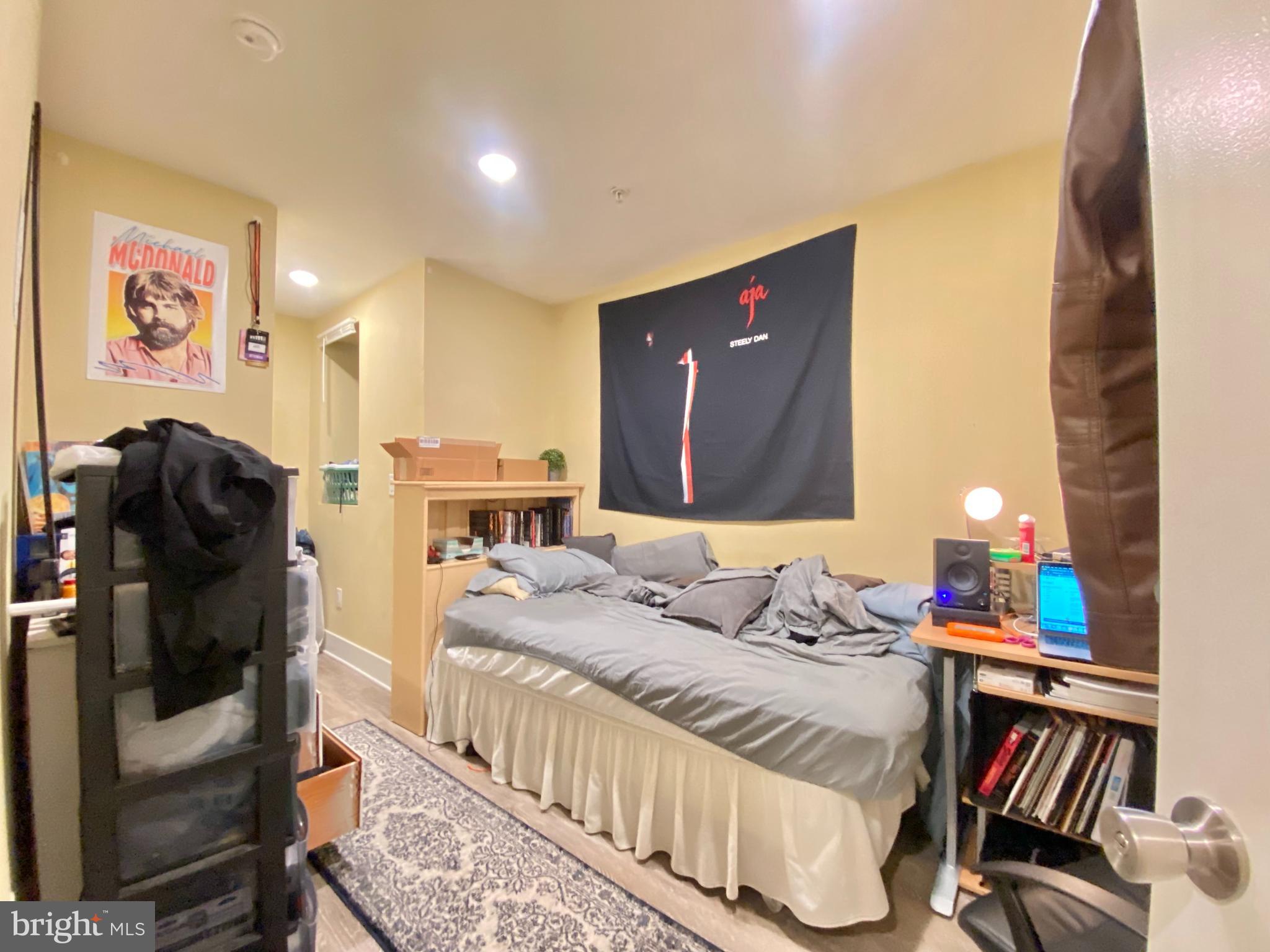 2214 North Camac Street, Unit A Philadelphia, PA 19133 - Photo 18 of 18 a bedroom with a bed and a couch