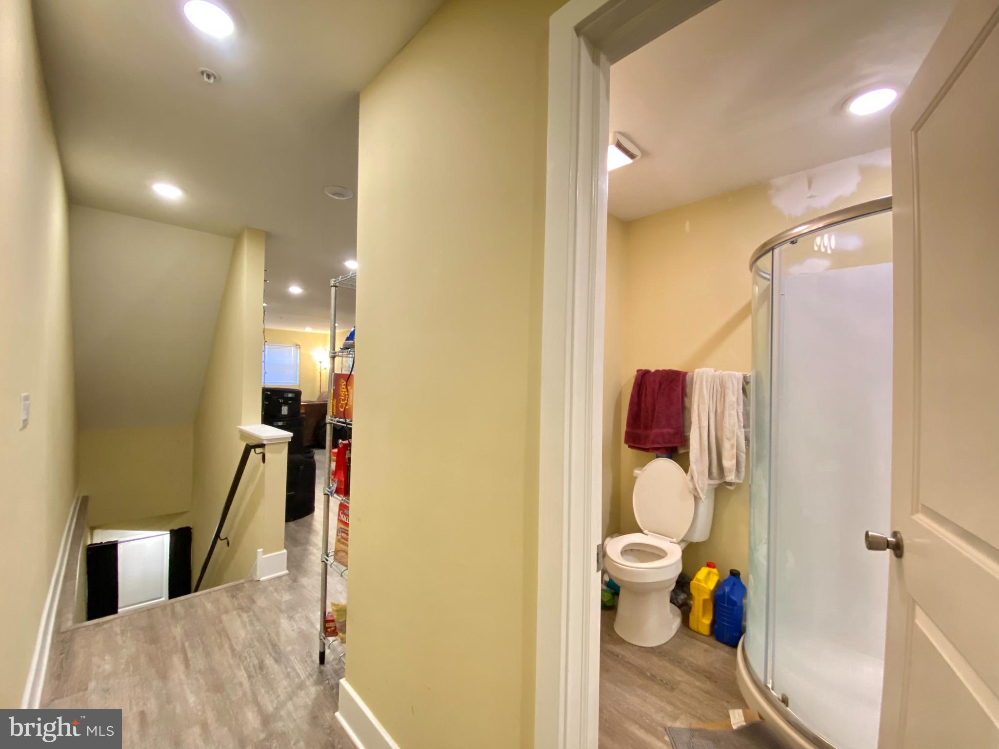 2214 North Camac Street, Unit A Philadelphia, PA 19133 - Photo 5 of 18 a bathroom with a toilet sink and a mirror