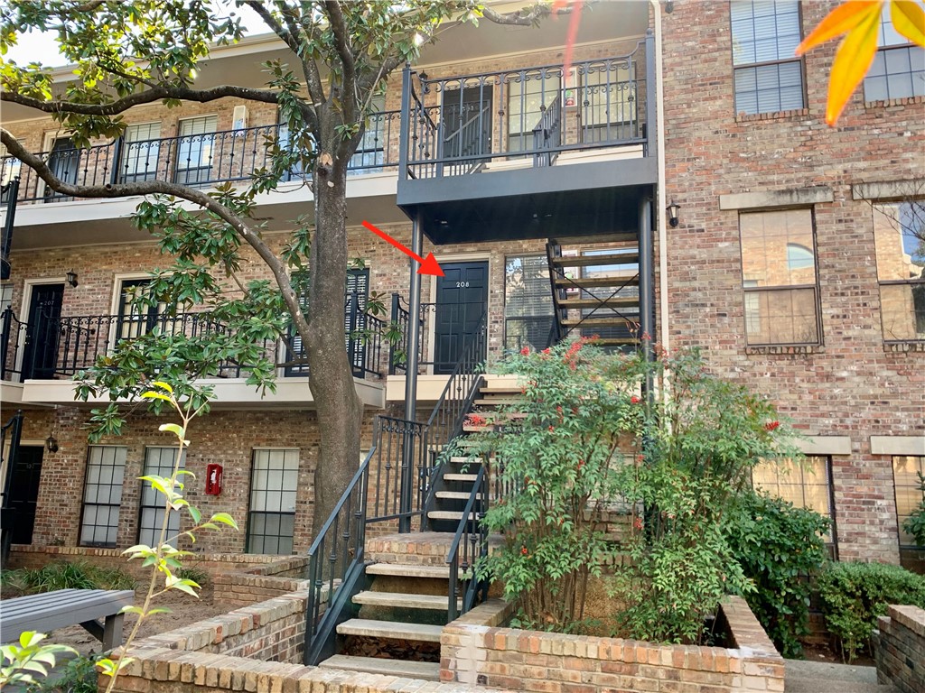 2801 Rio Grande Street, Unit 208 Austin, TX 78705 - Photo 1 of 1 Head up the stairs in the courtyard to your second floor unit