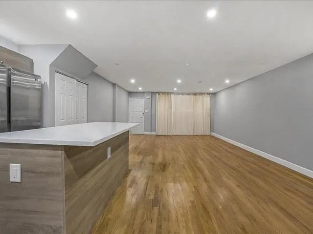 a view of kitchen with wooden floor